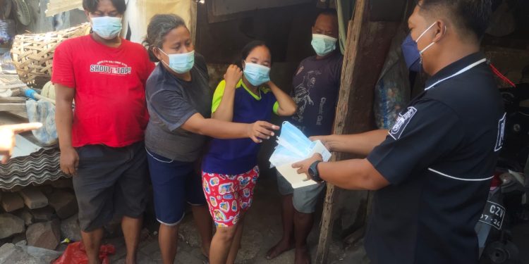 Baksos di Rawa Kambing, Polisi Bandara Soetta Bagikan 100 Karung Beras